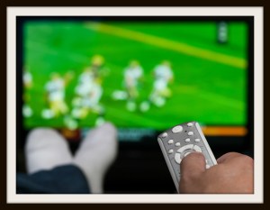 Couch potato watching television in a family room